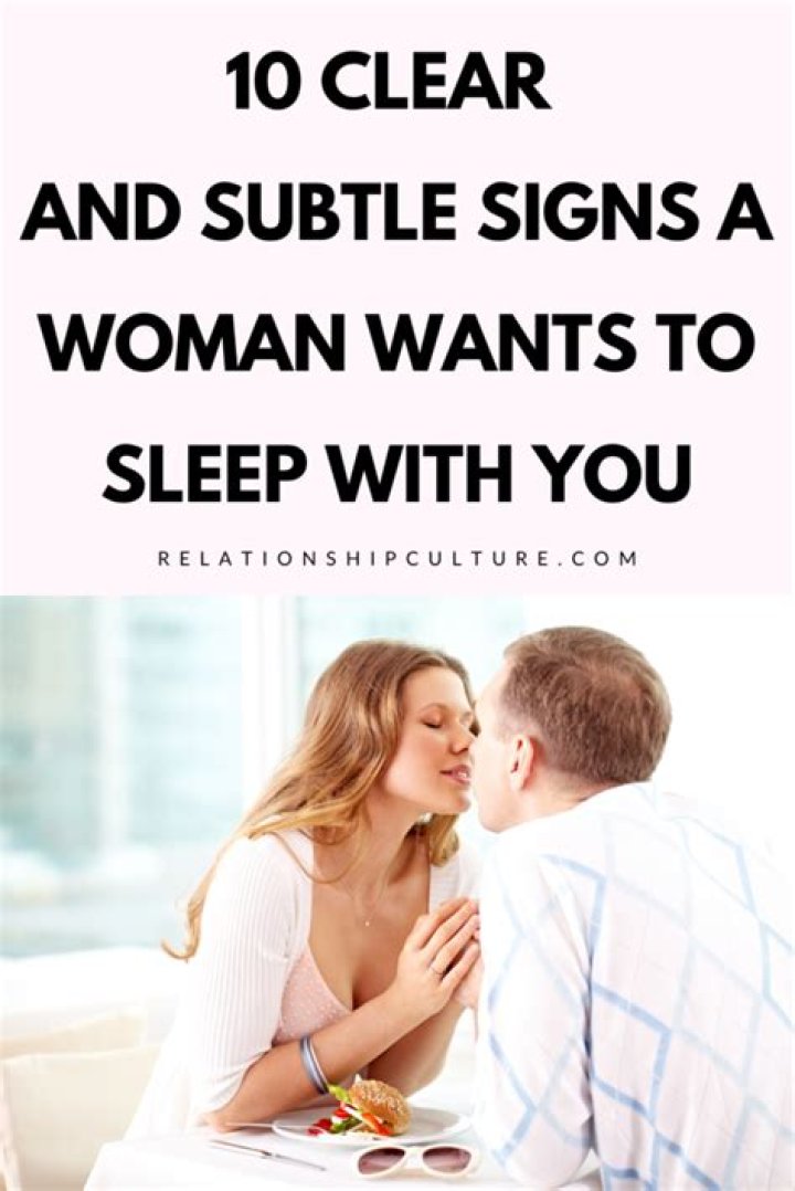 How do you tell if a woman wants to sleep with you?